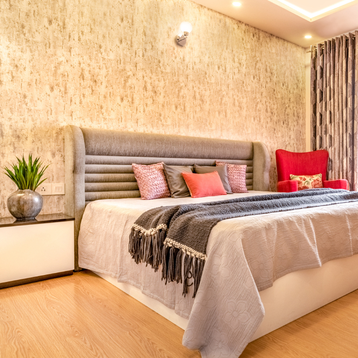 Beige Textured Bedroom Wallpaper With Wall Sconce Livspace