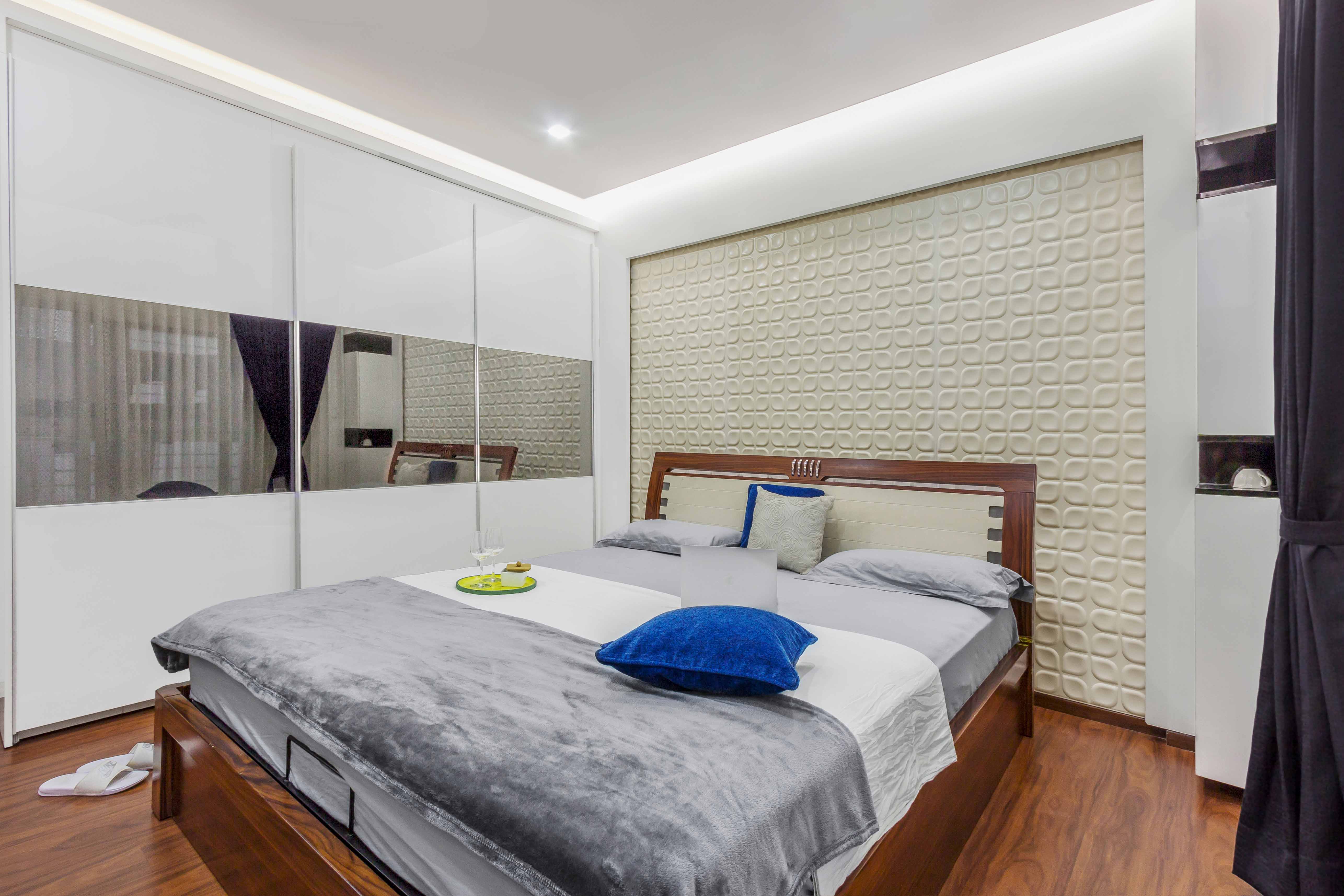 Compact Bedroom Design With Beige 3D Geometric Accent Wall | Livspace