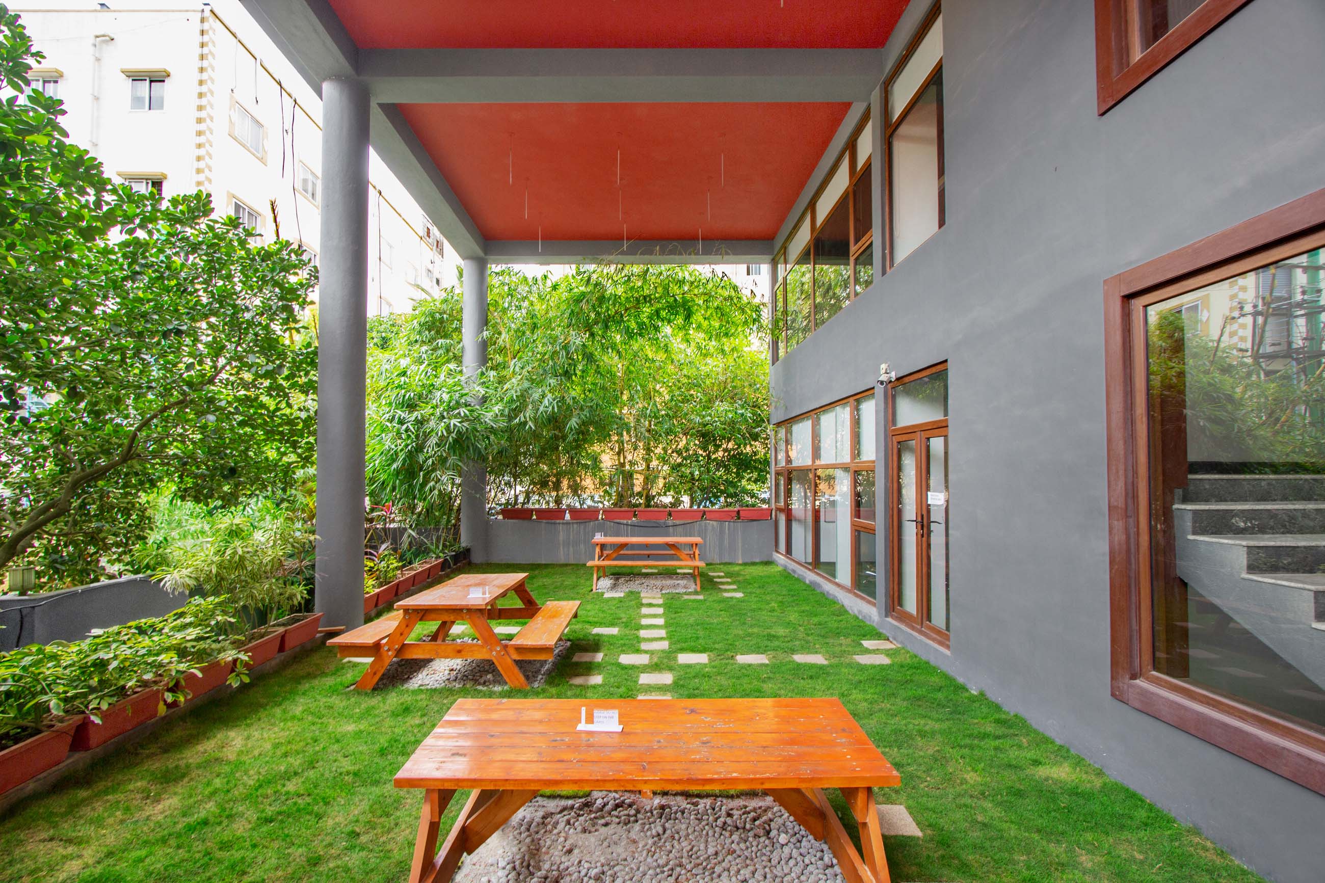Contemporary Balcony Design with Grey Accent Wall and Ample Seating ...
