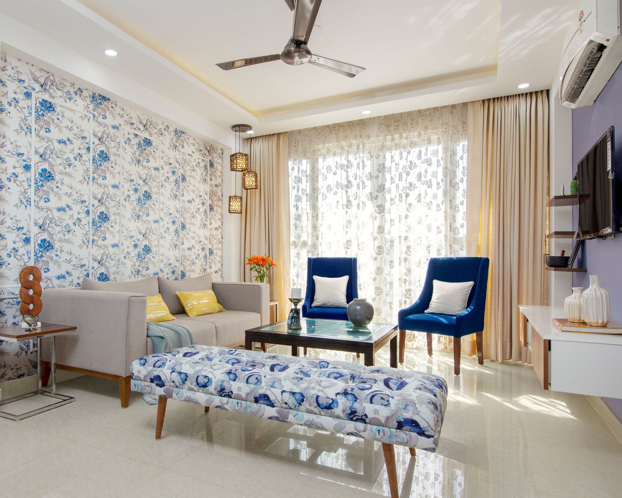 Living Room Design With Blue And White Floral Wallpaper - 9x7 Ft | Livspace