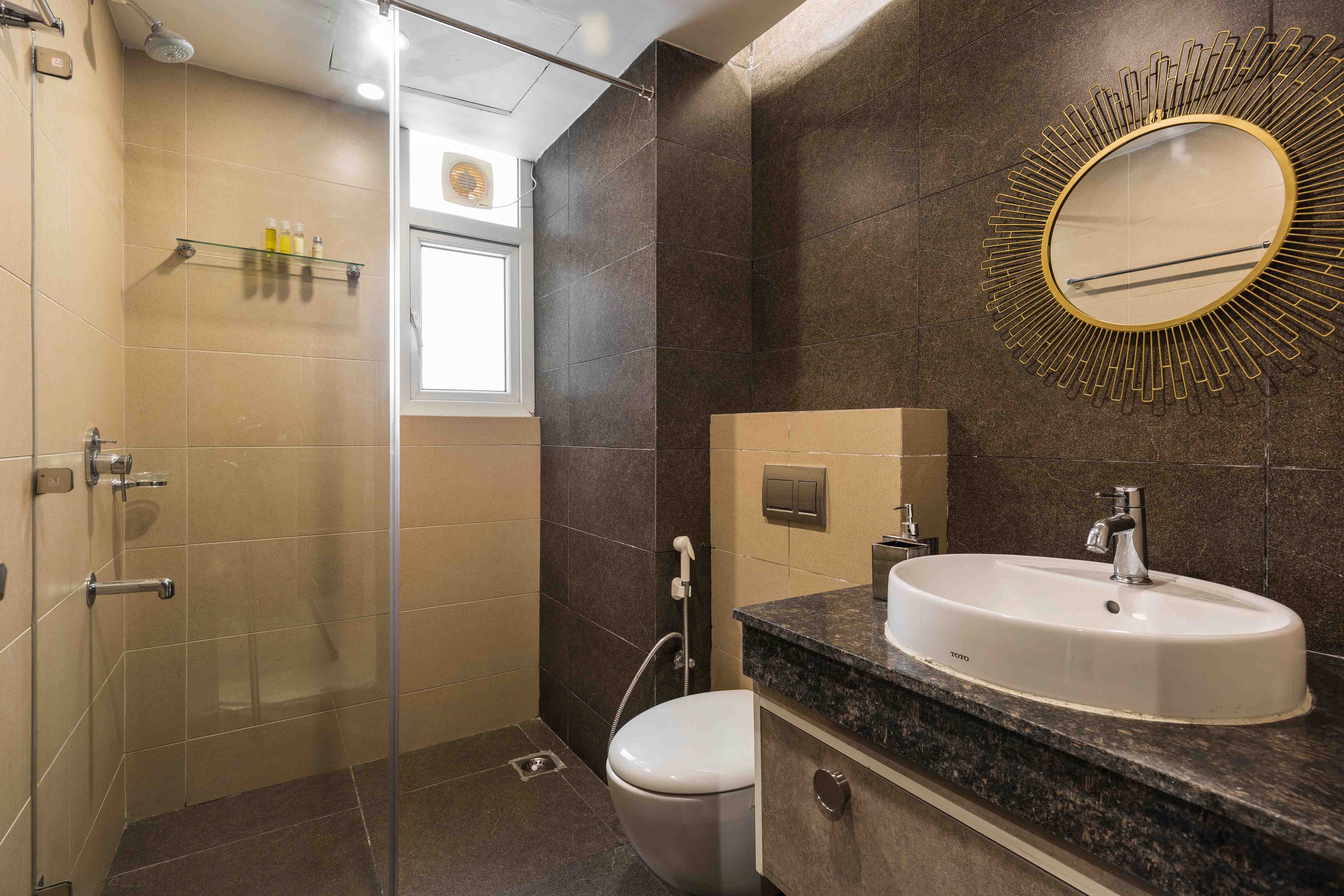 Beige And Brown Bathroom Design With A Shower Area | Livspace