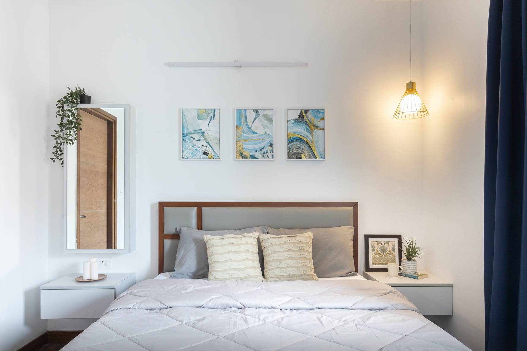 Spacious White Guest Bedroom Design With Dressing Unit | Livspace