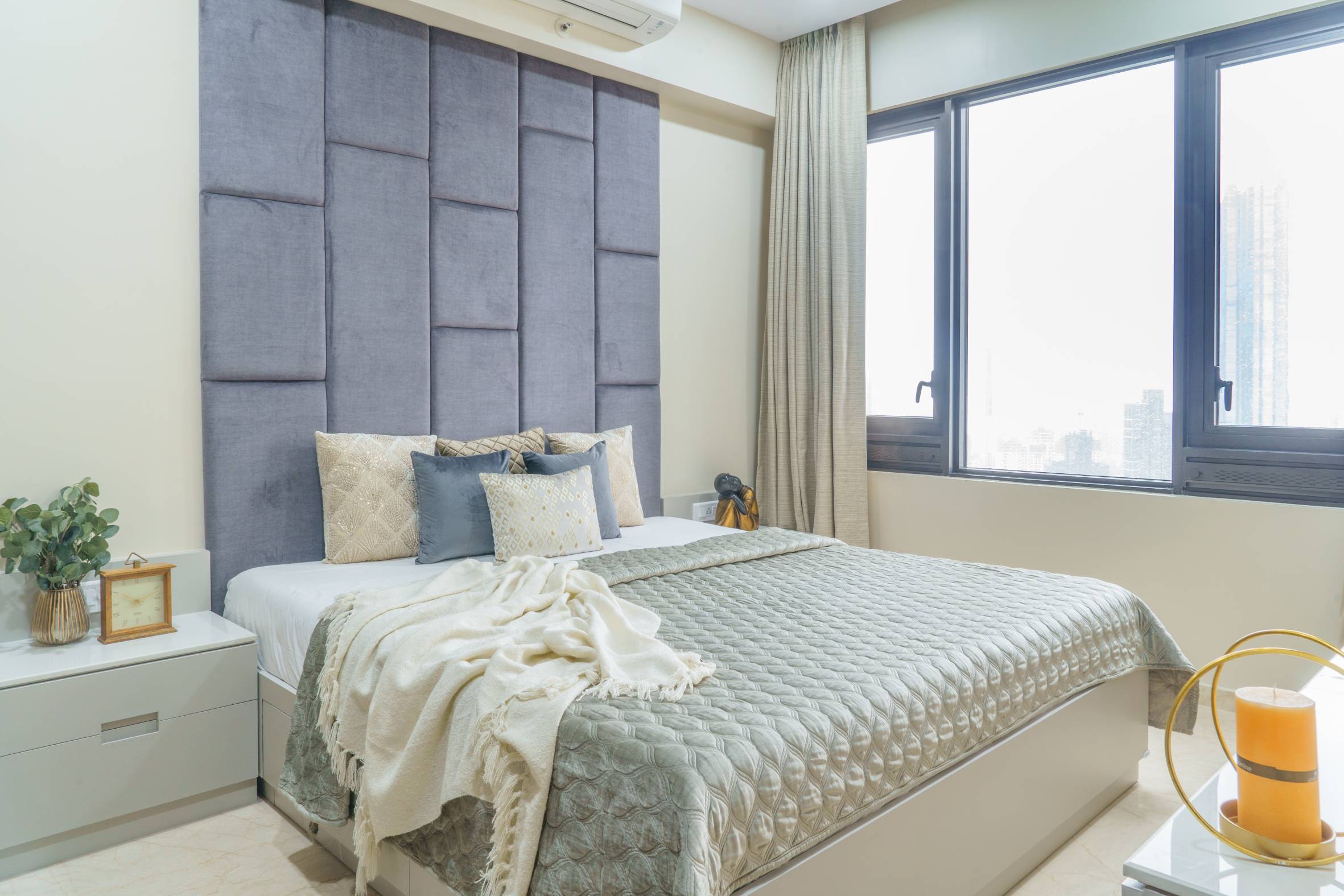 Compact Bedroom Design With White Walls And A Muted Blue Tufted ...