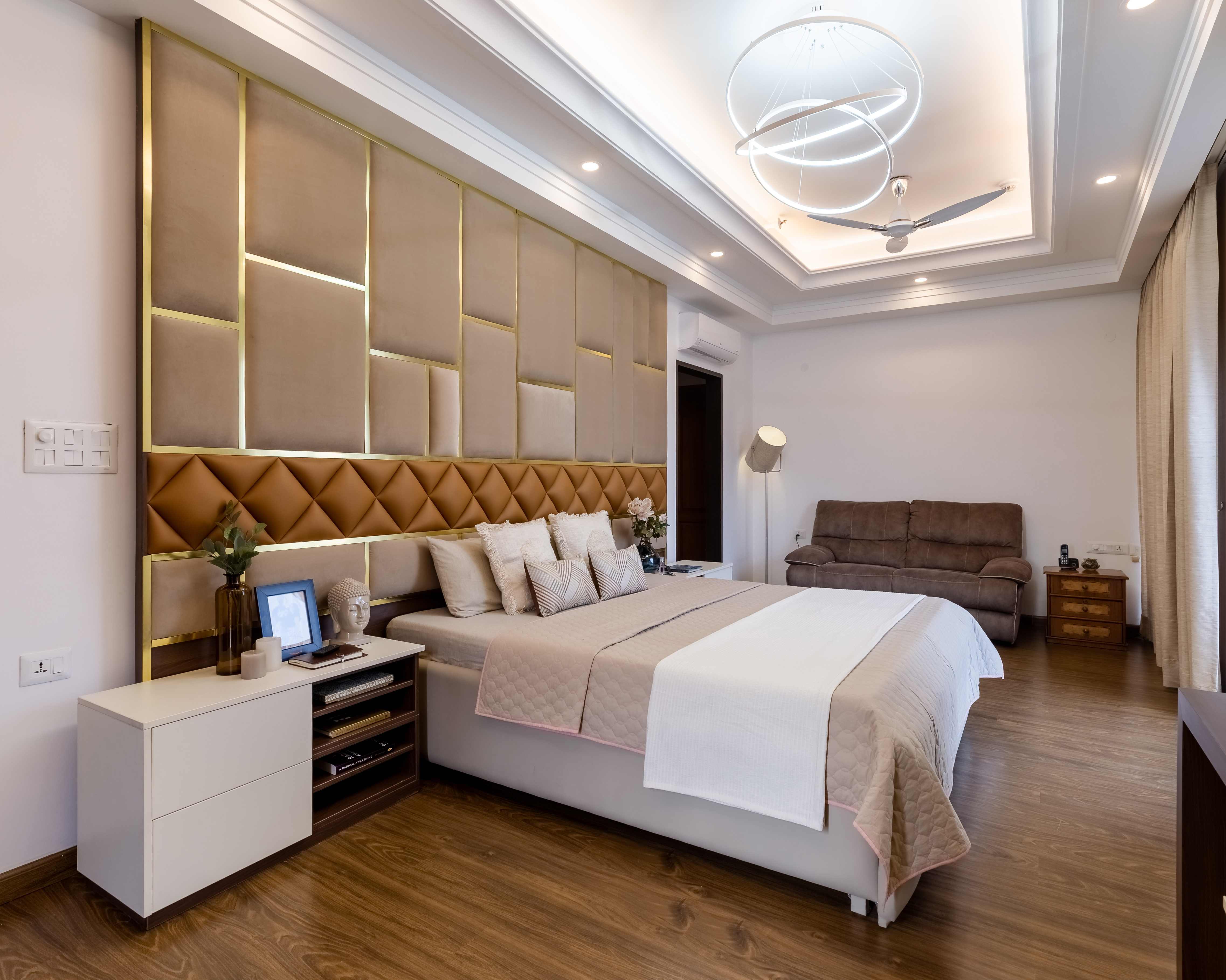 Bedroom Wall Design With A Metal Frame And Cushioned Panelling | Livspace