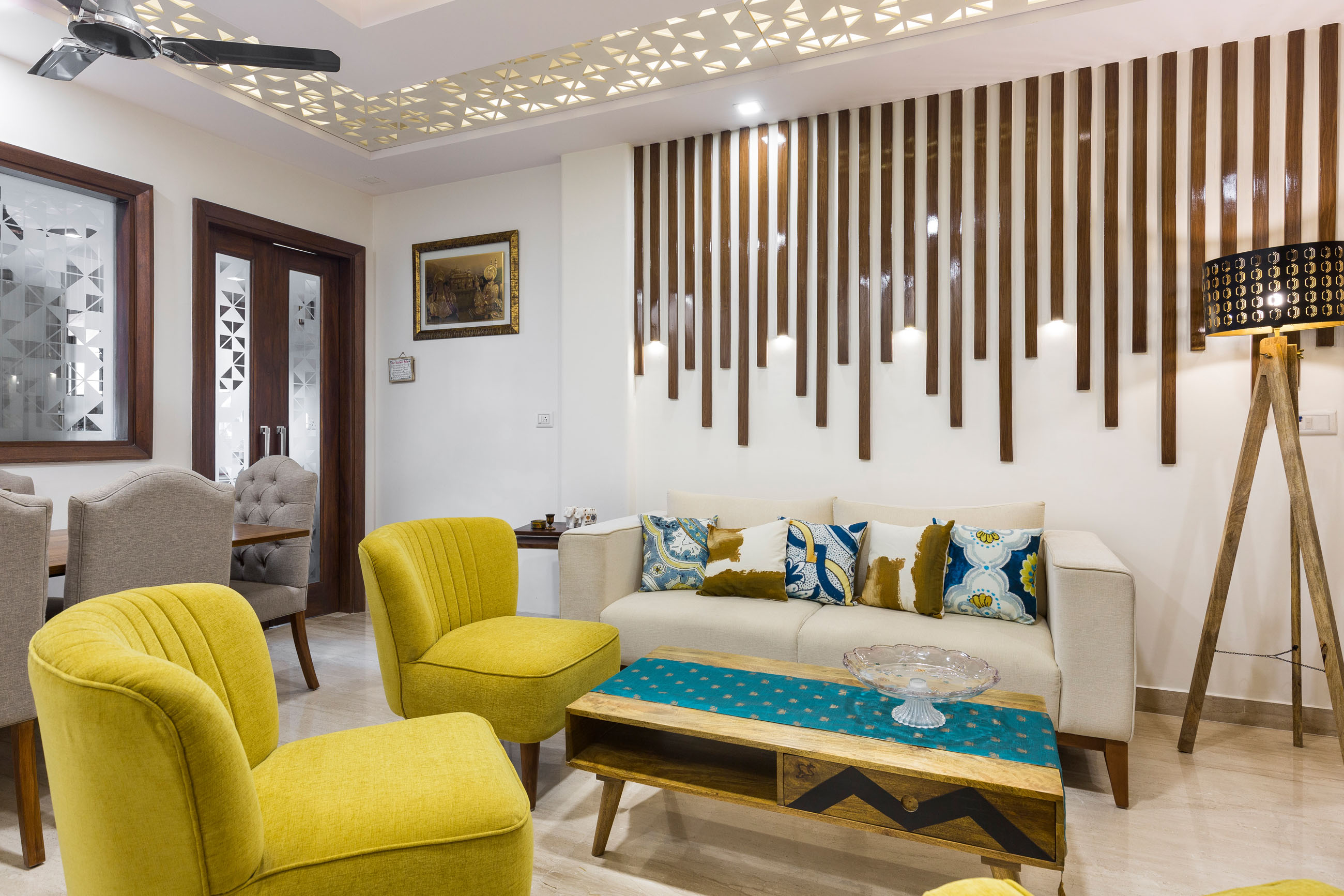 Delhi 3-BHK Interior Design With Colourful Living Room And Ornamental ...