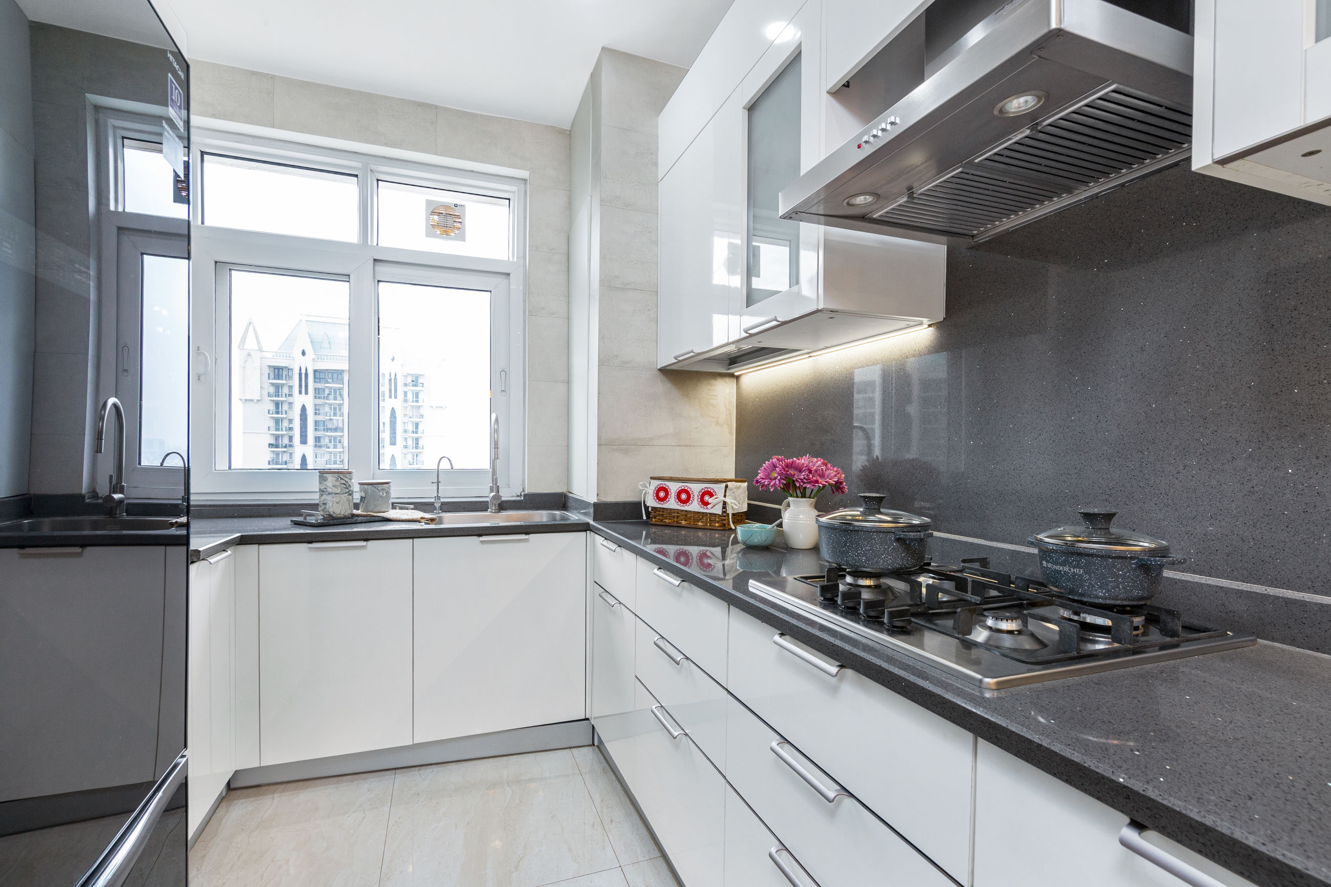 Gurgaon 2-BHK Flat Design With White And Grey U-Shaped Modular Kitchen ...