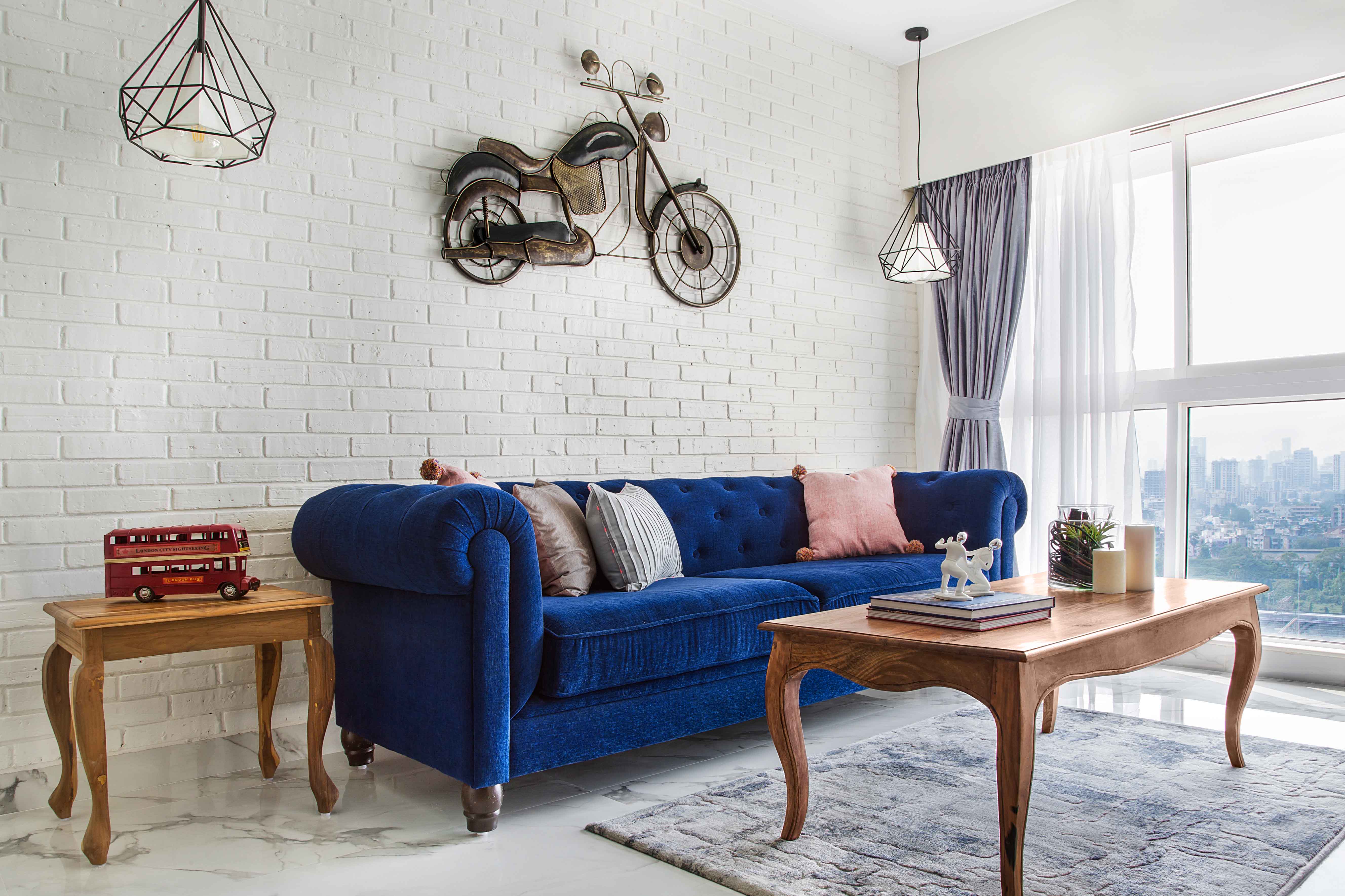 White Living Room Design With Dark Blue Sofa And Wooden Coffee Table ...