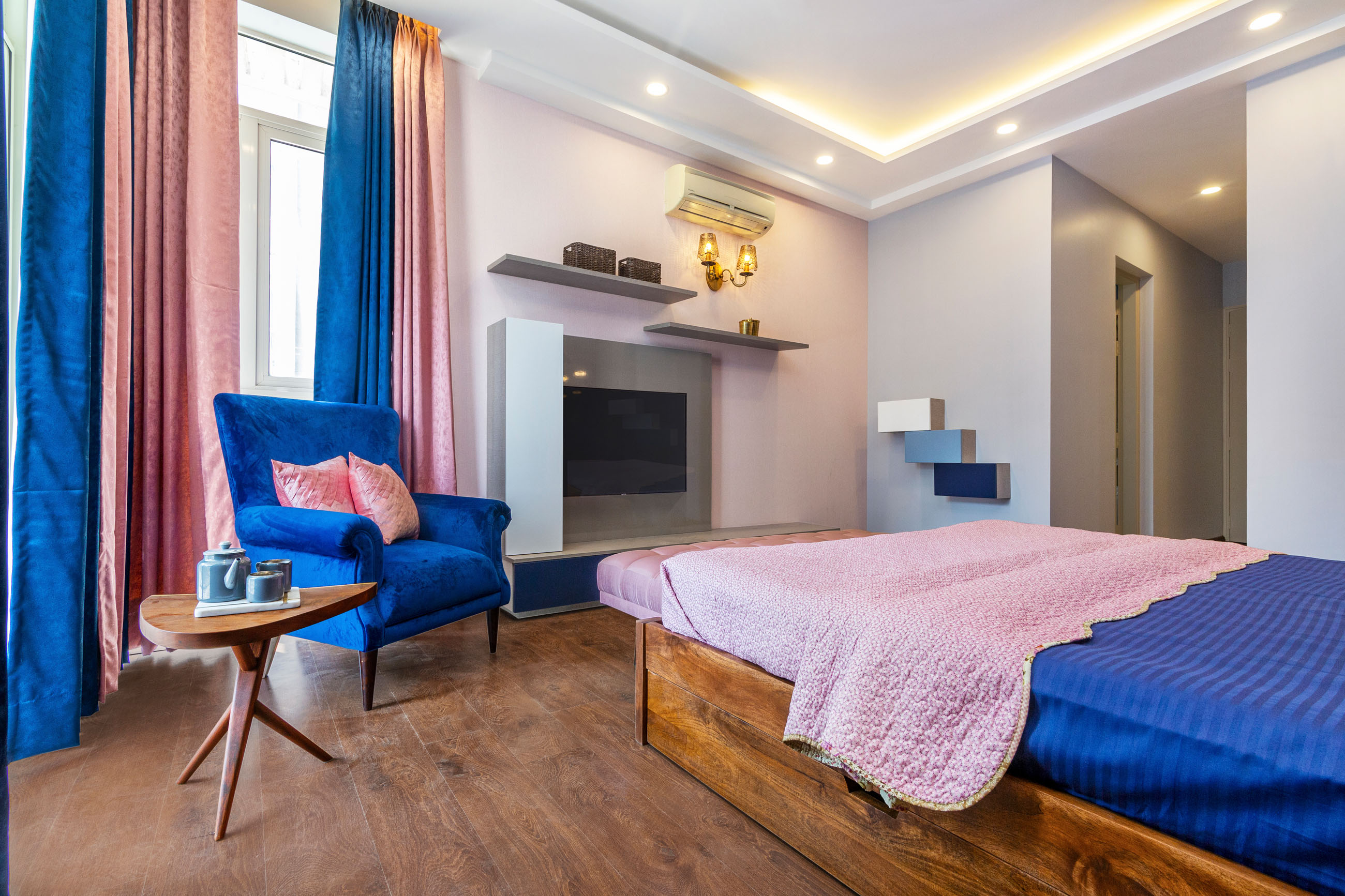 Contemporary Master Bedroom Design with Pink Tufted Headboard | Livspace