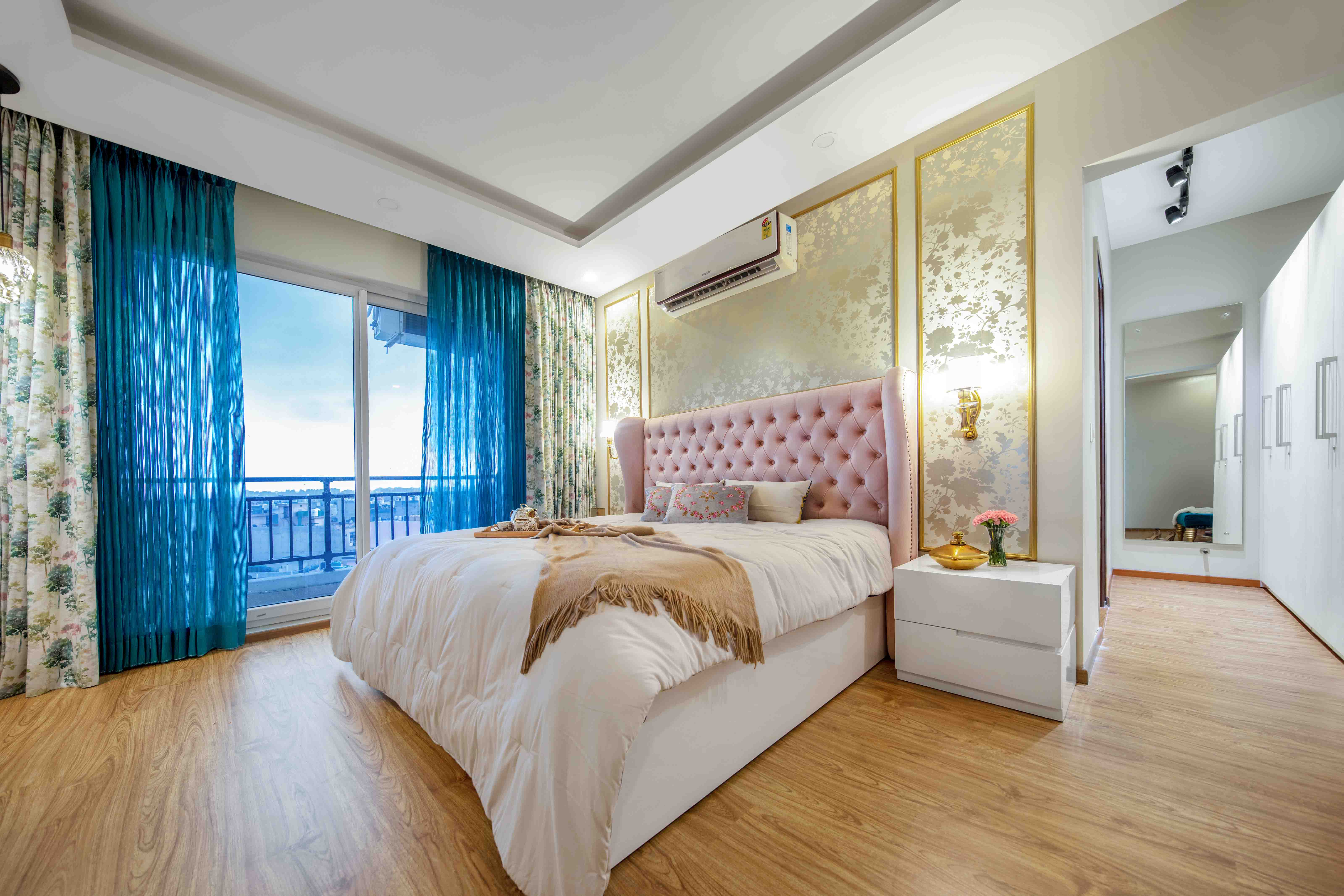 Master Bedroom Design With Floral Beige Wallpaper And Gold Trims | Livspace