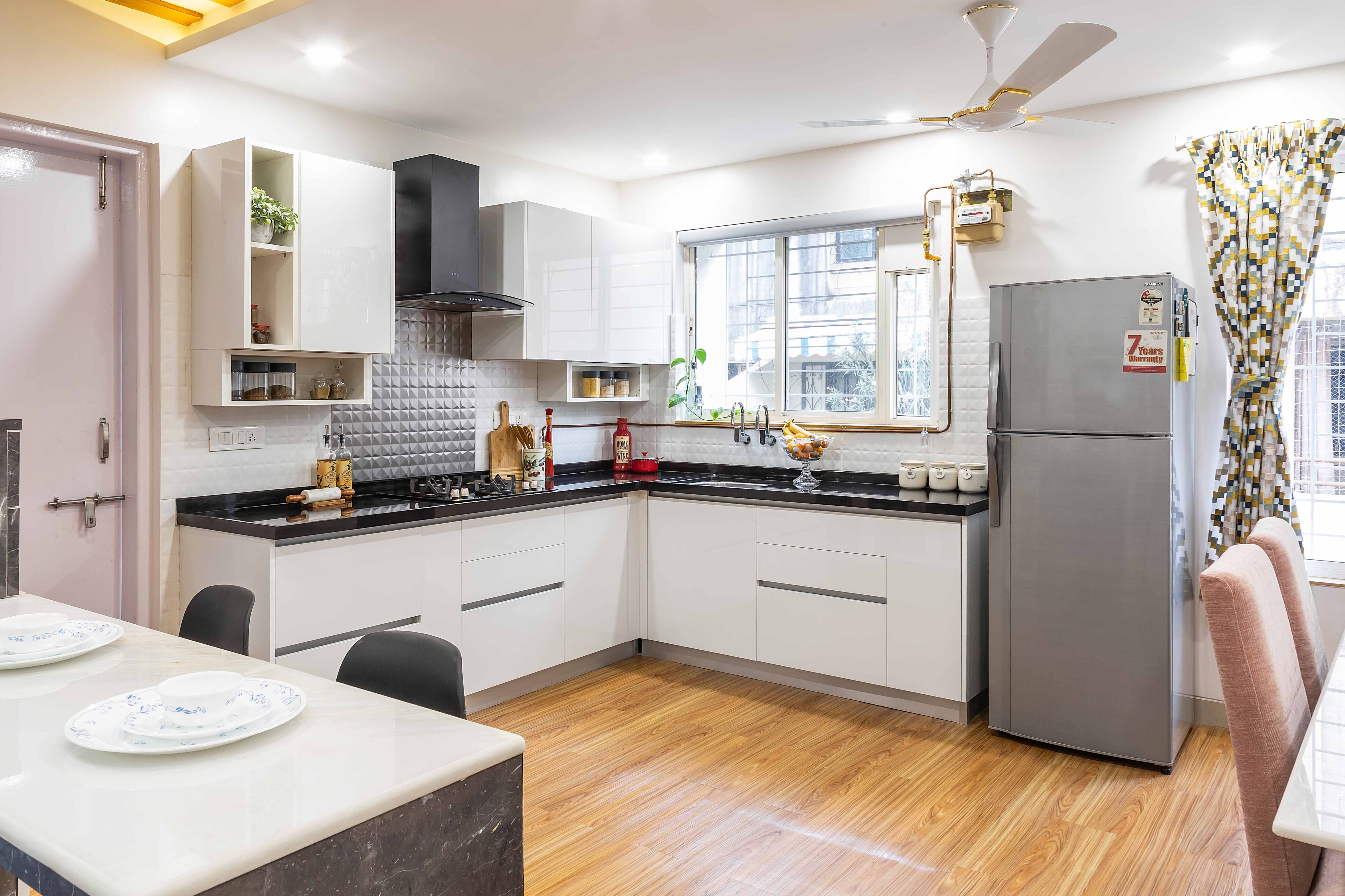 Modular White L Shaped Kitchen Design With Black Countertop | Livspace