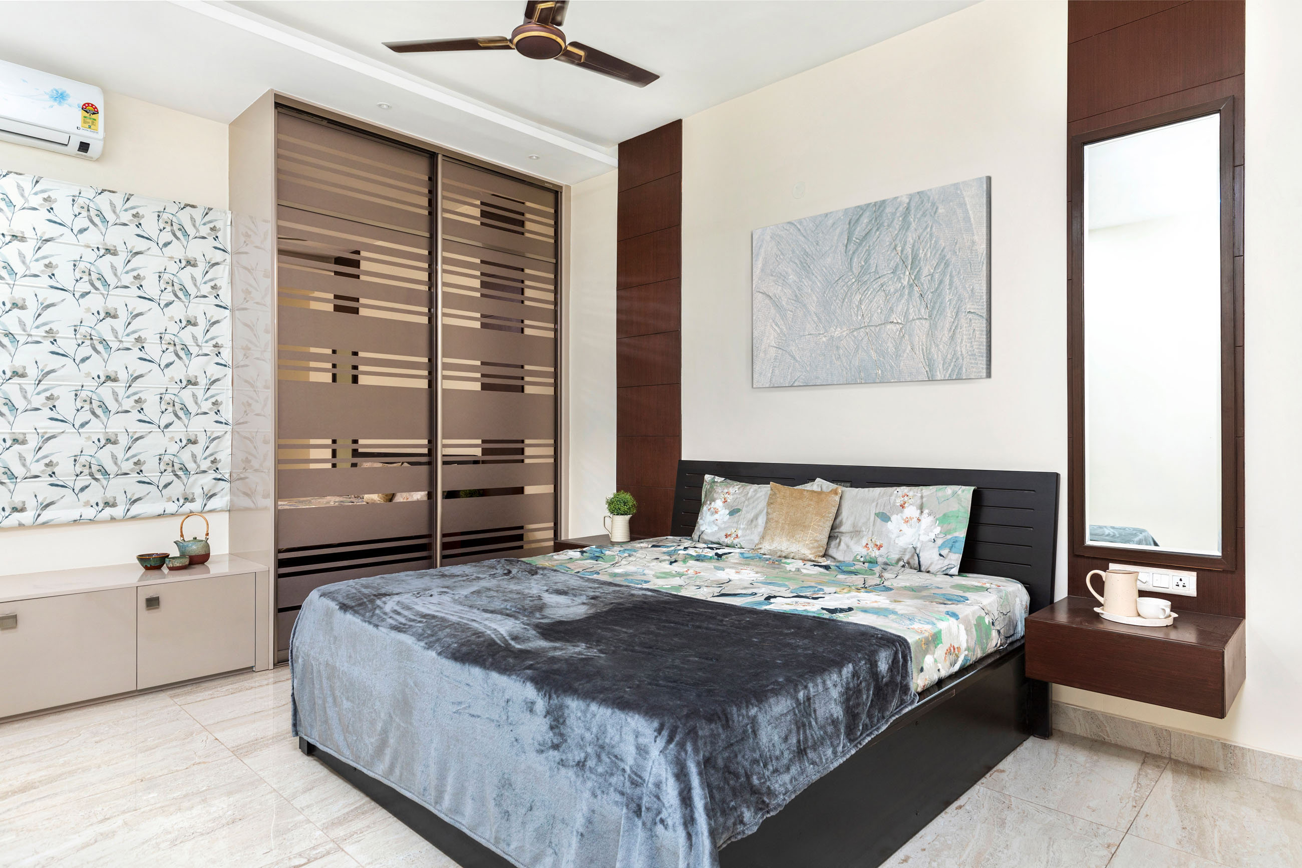 Master Bedroom Design With Brown And Glass Wardrobe | Livspace