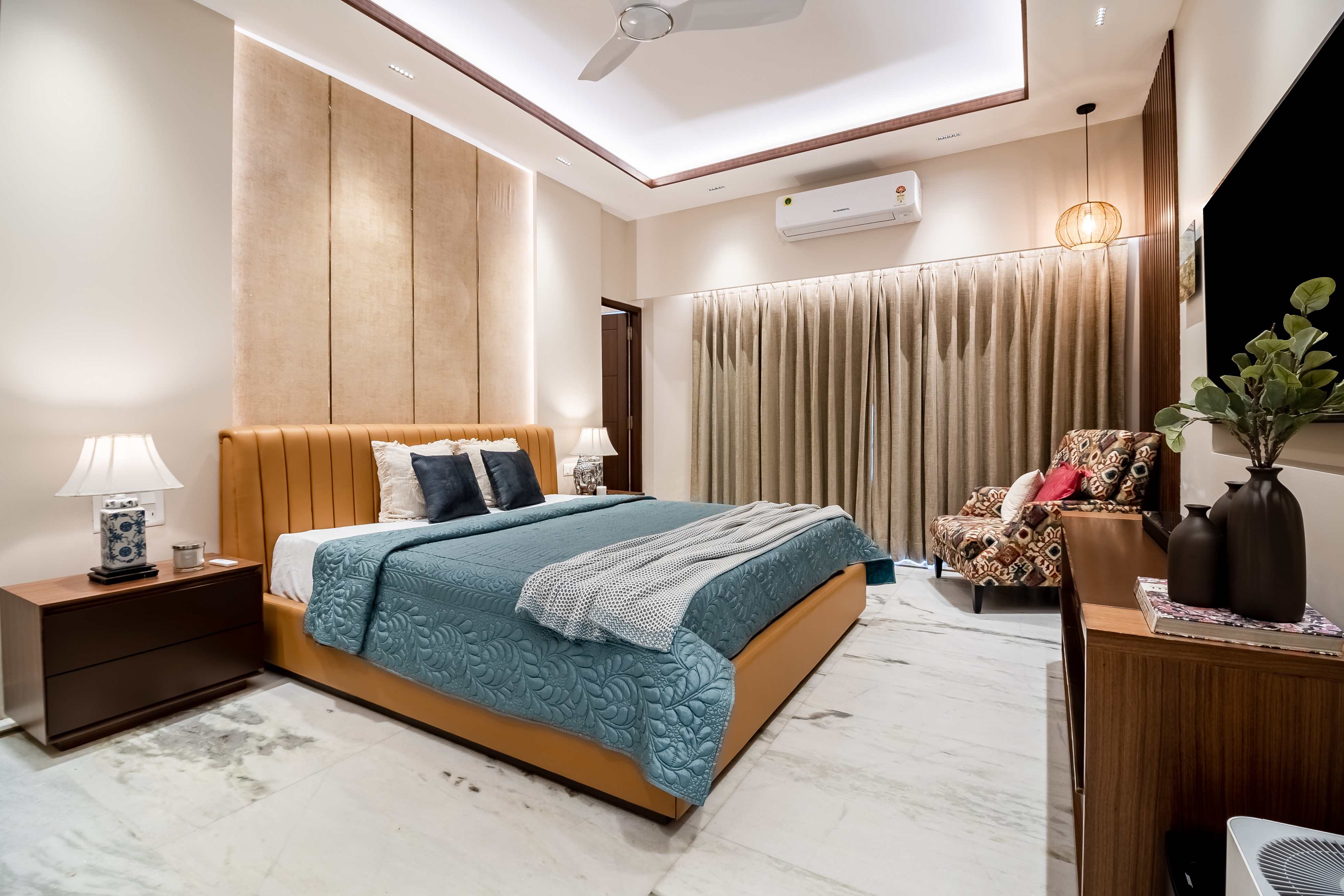 Spacious Bedroom Design With A Beige Textured Wallpaper | Livspace