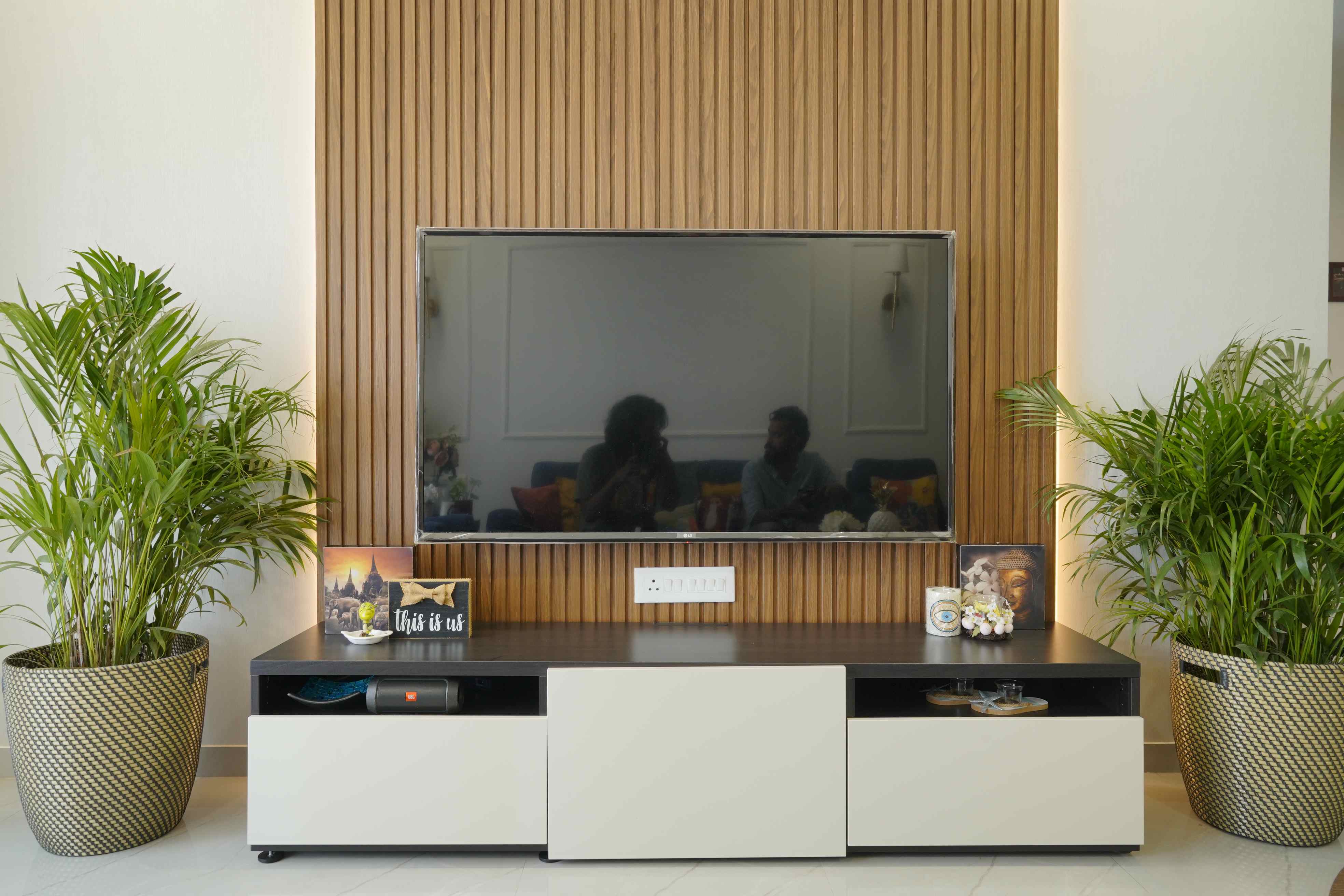 Brown Wall Design With Wooden Details | Livspace