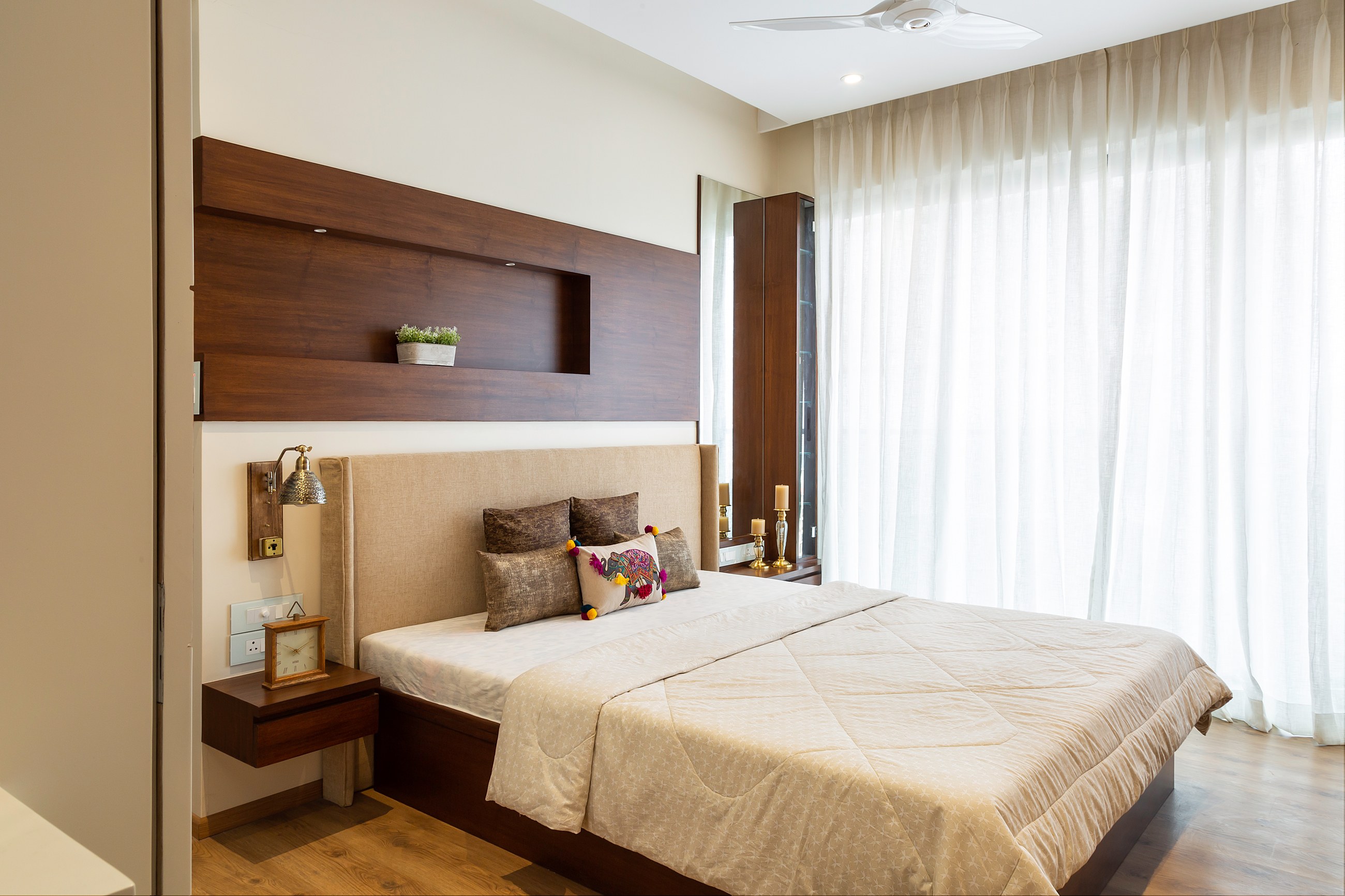 Master Bedroom Design With Wooden Wall Panelling And Flooring | Livspace